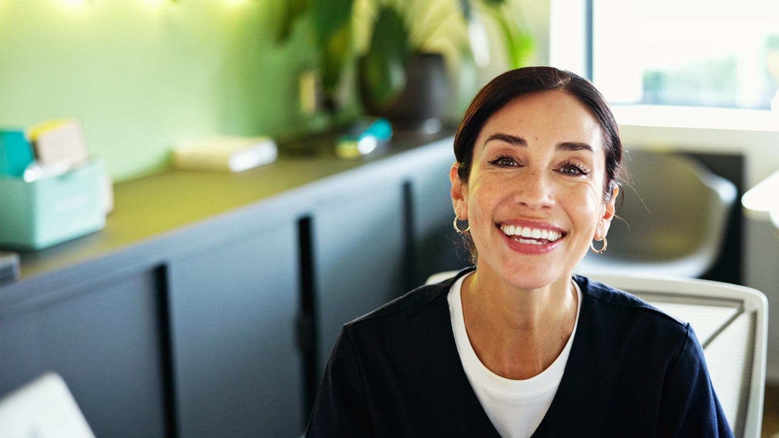 Smiling dental practice receptionist