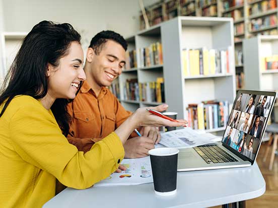 Two dentists having online training course