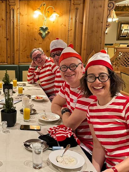 Denplan dentists wearing Where's Wally fancy dress whilst eating breakfast