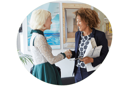 Two women shaking hands