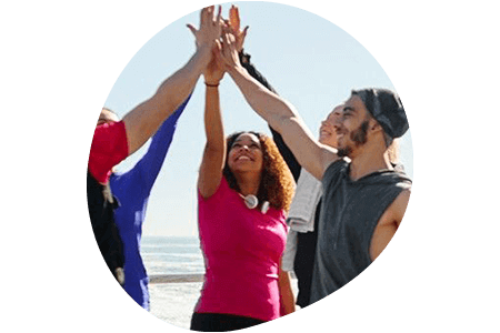 People high fiving into the air
