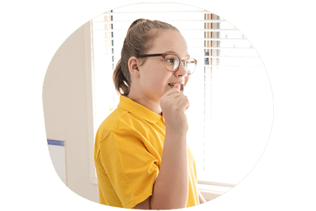 Child brushing her teeth before going to school
