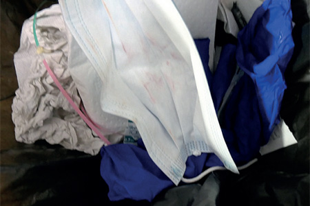 Contaminated waste in a domestic waste bin