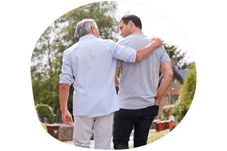 Retired man walking with his son