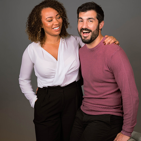 Dentists Hanifa and Tom posing together and smiling