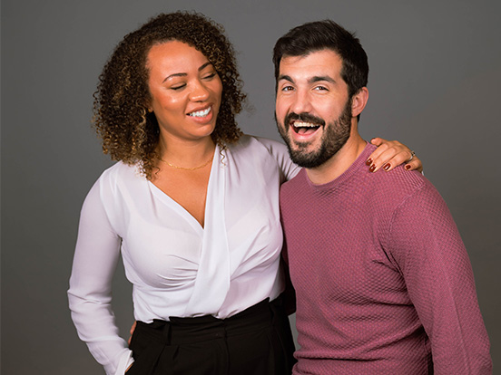 Denplan member dentists Hanifa and Tom sitting together and smiling