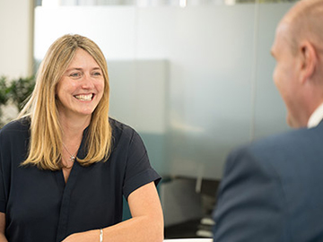 Catherine Rutland, Clincal Director talking to Louis MacKenzie, Head Dental Officer