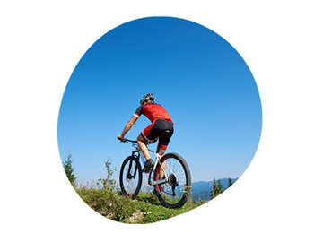 Man cycling up a hill