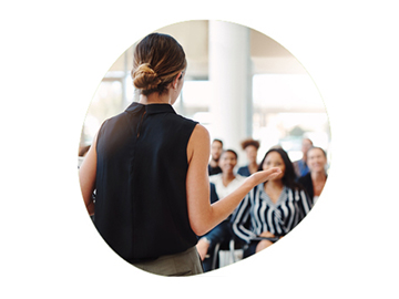 Woman standiong and talking to an audience