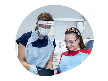 Dentist and patient looking at an iPad